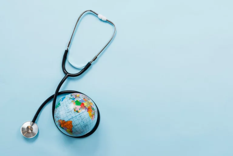 stethoscope hugging earth blue background